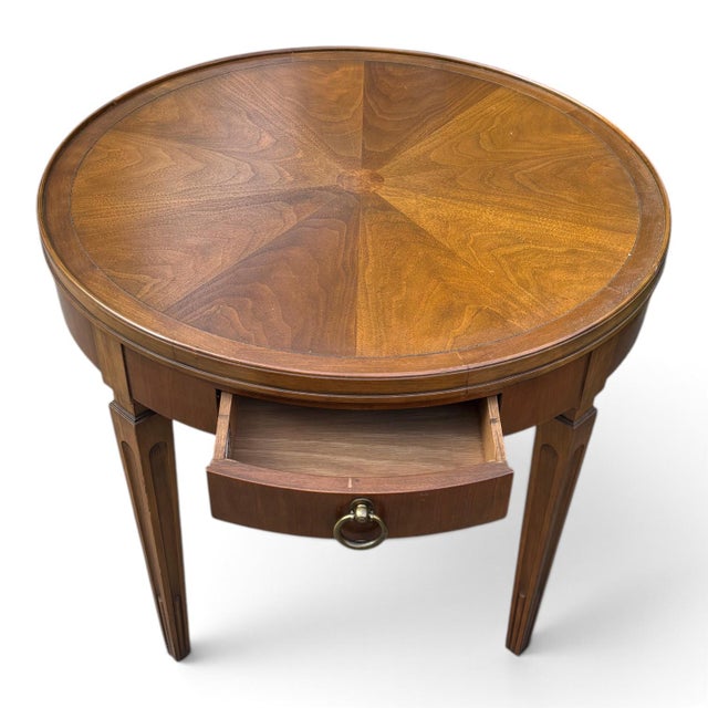 A beautifully crafted vintage side table by Baker Furniture, showcasing the timeless elegance and exceptional...