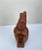 Peruvian Figural Wood Carved Sculpture After Moche Stirrup Vessel, Dreamer: A stirrup vessel takes on the shape of a...