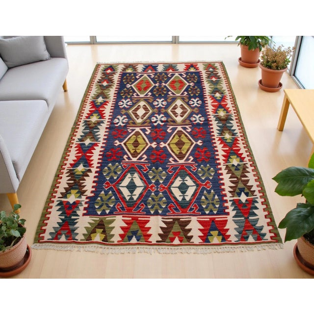 Handwoven in Western Anatolia during the 1980s, this vintage Turkish kilim embodies centuries of artisanal heritage and...
