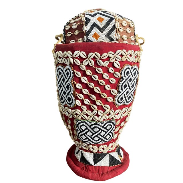 This vintage Kuba basket from the Democratic Republic of the Congo is made by hand using raffia palm fibers and decorated...