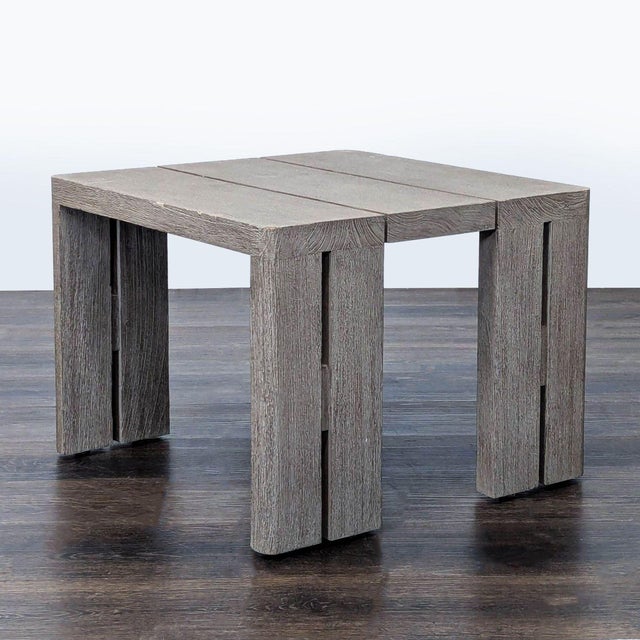 This Restoration Hardware side table features a modern block design with a weathered teak wood finish. Its clean lines and...