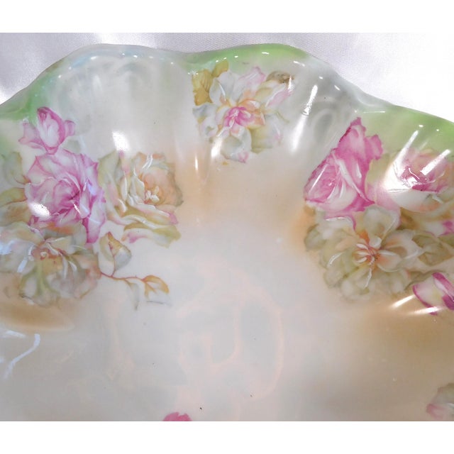 This is a white and pale green Moritz Zdekauer MZ Austria serving bowl with pink and white flowers in the bowl and also on...