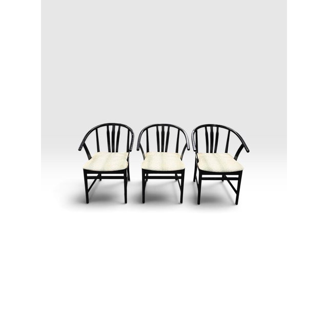 A sophisticated set of five vintage Hungarian bentwood armchairs showcasing timeless European craftsmanship and graceful...
