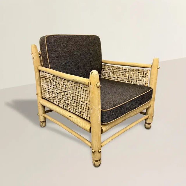 A rustic and chic early 20th century American hickory framed armchair with woven sides and back, and a creamy ivory...