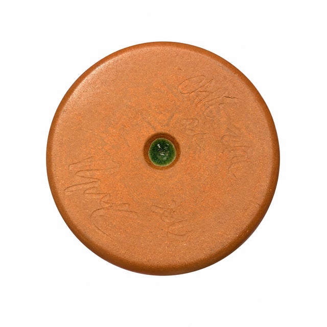Charming studio pottery apple baker featuring a sculptural, ruffled rim and a rich moss-green glaze with earthy brown...