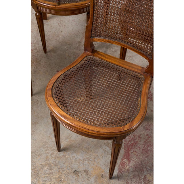 French Set of 6 | French Louis XVI Style Dining Chairs With Hand Caned Seats + Backs With Fluted Legs (C. 1920) For Sale - Image 3 of 10