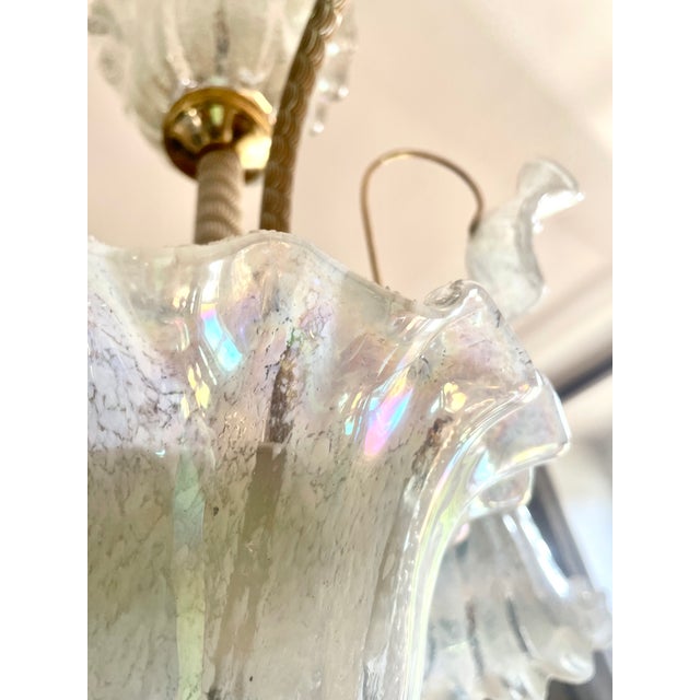 Large Italian chandelier from the 1980s with 3 lights twisted gold-tone metal frame iridescent Murano glass suspended by a...