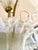 Large Italian chandelier from the 1980s with 3 lights twisted gold-tone metal frame iridescent Murano glass suspended by a...