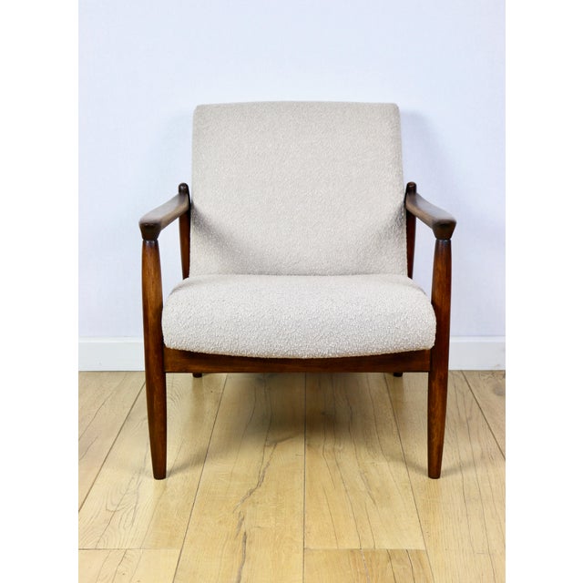 GFM-64 armchair, designed by Edmund Homa from the 1970s, beige boucle upholstery. 2 pieces available. This unique GFM-64...