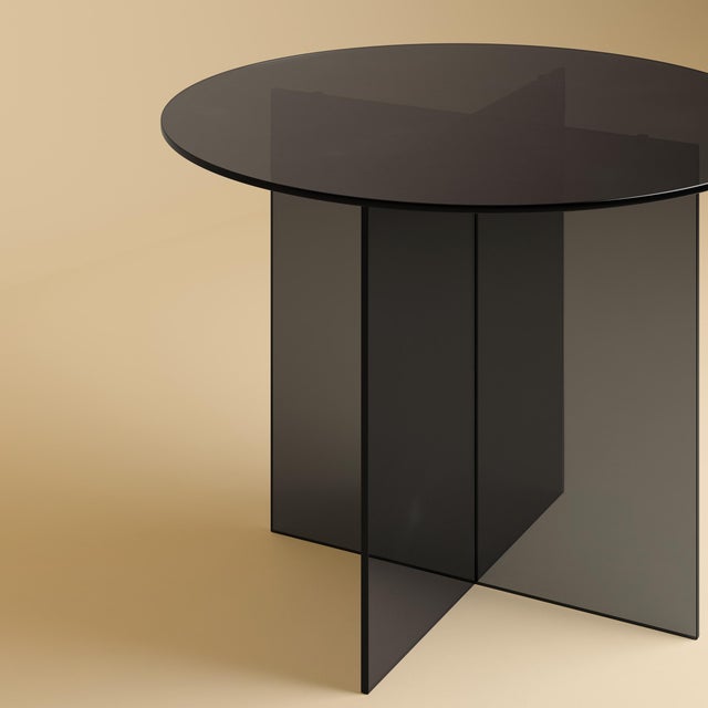 The Yuri is a smoked glass dining table, an essay in lightness assembled entirely from Italian glass. Where Lebanto's...