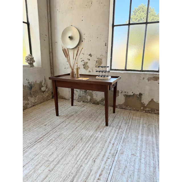 Old small side table, work table or presentation table style, from the 50s all in dark stained walnut. resting on four...