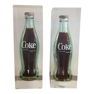 Pair of Mid-Century Modern Op Art Resin Cased Coca Cola Unopened Bottles
