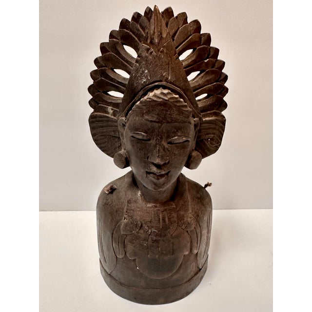 Vintage hand carved hardwood bell sculpture of a Balinese dancer's head. Head is adorned with an ornate ceremonial...