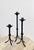 Simplistic but impactful form. Hand-forged stem with central ring or knot detail, stable tripod legs, wide drip cups, and...