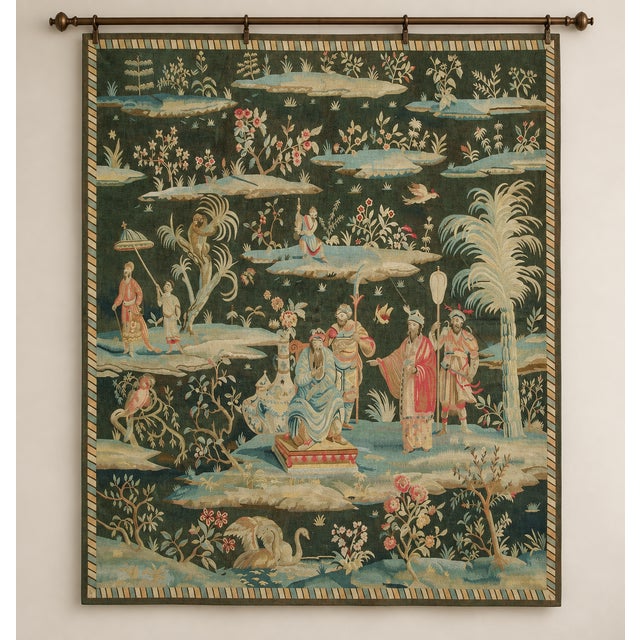 This decorative vintage tapestry presents an elaborate Chinoiserie-inspired garden scene filled with elegantly dressed...