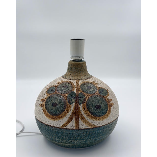 This exquisite mid-century modern table lamp, part of the "Erika" series, was designed by Noomi Backhausen for the...