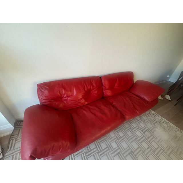 Authentic Poltrona Frau Ouverture red leather sofa made in Italy. Beautiful designer piece in genuine red leather with...