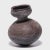 Inspired by the natural world, Nupe ceramicists fired this water vessel in the shape of a gourd. The vessel's varied...
