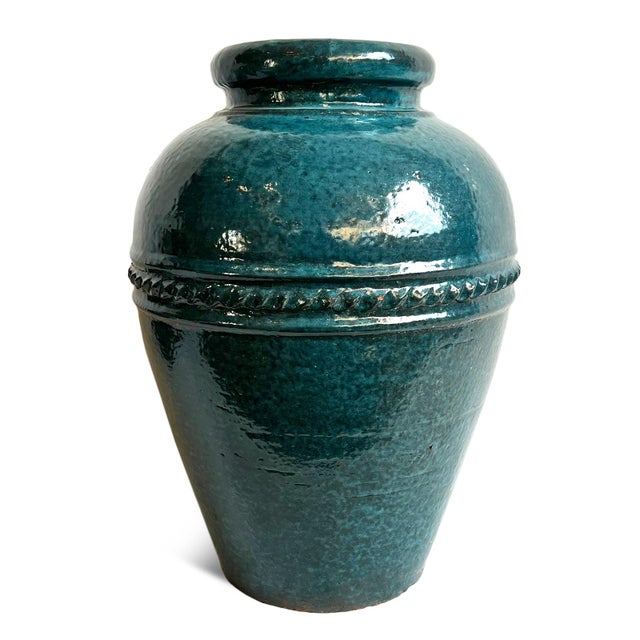 Beautiful Indonesian vintage ceramic vase with original turquoise blue glazed finish. Classic shape with charming subtle...