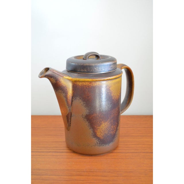 Finnish Ruska stoneware coffee pot by Ulla Procope for Arabia, 1960s The coffee pot is marked with the Arabia company's...