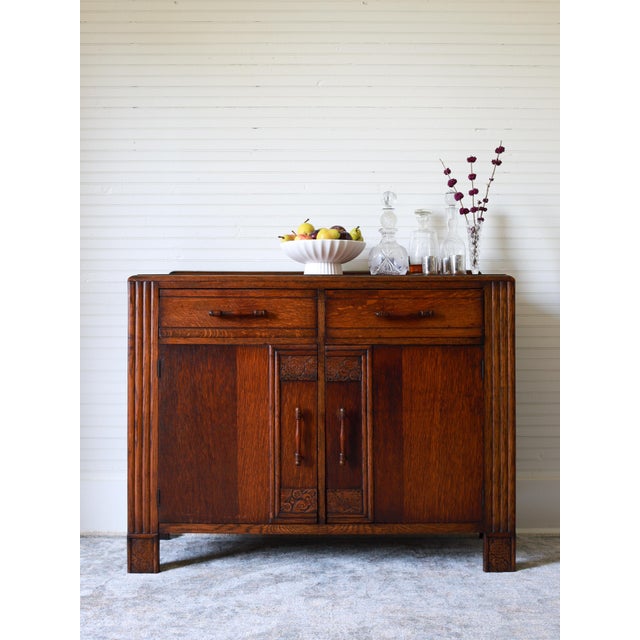 This handsome piece is an Art Deco sideboard or credenza, dating from the 1920s - 1930s. Constructed from quarter sawn oak...