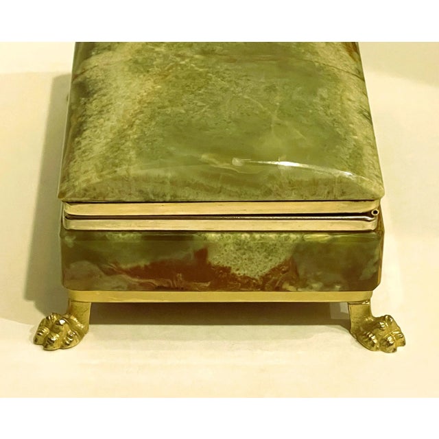 This is an exceptionally beautiful casket. The casket's vibrant natural onyx stone colors are electrifying. It is the...