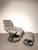 Comfortable Stressless recliner with matching footstool , upholstered in soft light grey leather and set on the brand’s...