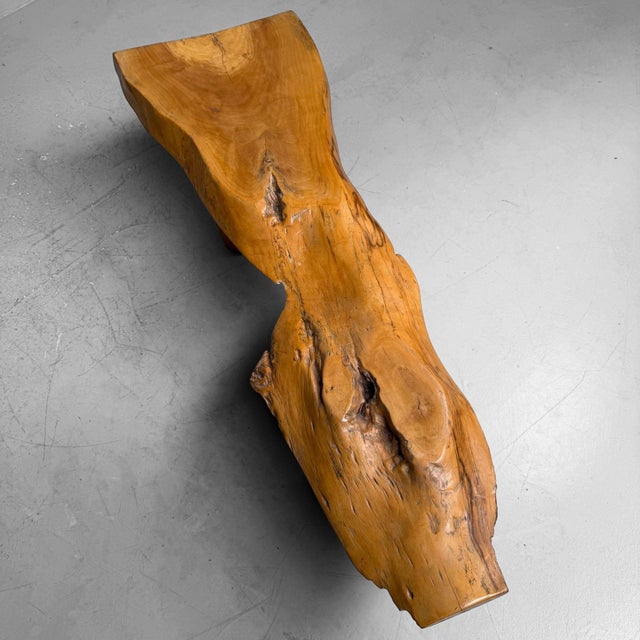 A distinctive japanese side table from the 1960s, crafted from a solid slab of wood (zelkova wood) with a pronounced...