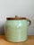 This vintage handcrafted ceramic storage jar from Maine combines a rounded form with the practical detail of a fitted lid...