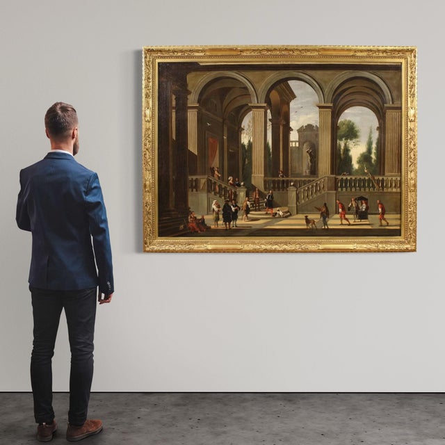 Large 17th-century Italian painting. Oil on canvas artwork depicting a splendid architectural capriccio with figures, of...