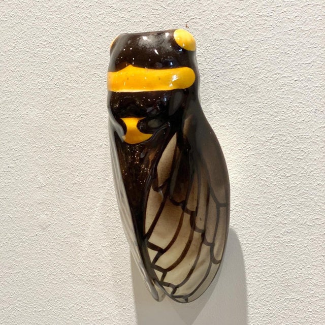 An early 20th-century French pottery "Cigale" or cicada wall pocket, meant to bring good luck to a home.