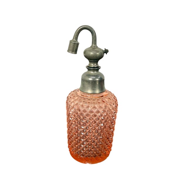 Elegant vintage bathroom vanity set made of pressed pink glass with a beautiful diamond pattern. The set consists of a...