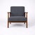 A stylish vintage 1990s ikea lounge armchair, featuring a clean scandinavian design with a solid teak frame and...