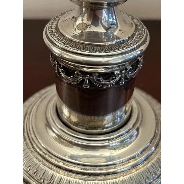 Monocera candlestick in 925 thousandths silver, empire style. Italian production of the 80s. Small signs of the time....