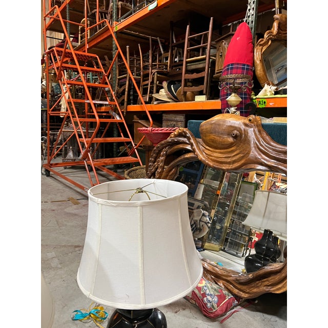 Up for consideration is a beautiful vintage pair of black ceramic MCM table lamps with gold accents and lampshades. These...