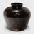Originally used for fermenting rice or sorghum into wine or vinegar, this squat, earthenware vessel from the early 20th...
