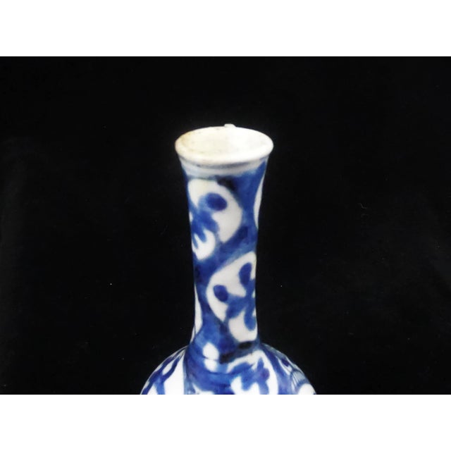 Pear-shaped porcelain vase decorated with stylized bats from the late Ming (1580-1644)/early Qing dynasty. The shape is...