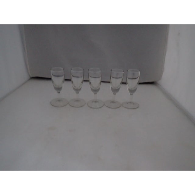 Midcentury Clear Glass Set of five Shot Glasses, No makers mark in excellent condition.