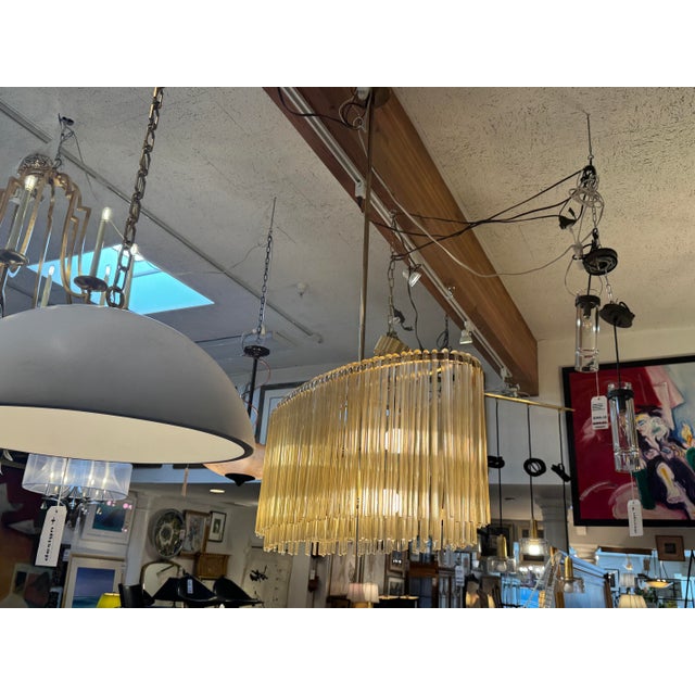 Design Plus Gallery presents an Orchard Midcentury Brass Chandelier from Ethan Allen. The chandelier has an antique brass...