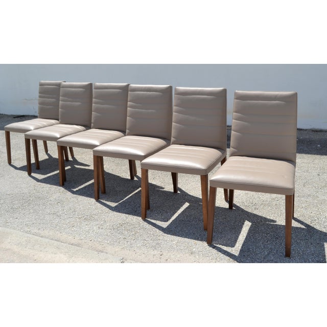 Set of 6 marked Poltrona Frau Vittoria Gray Leather and Wood Legs Dining Chairs. Made in Italy with exceptional...