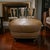 Elevate your living room with this beautifully crafted oversized leather ottoman, upholstered in a rich caramel brown hide...