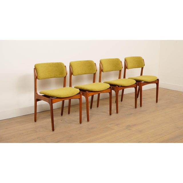 A set of 4 beautiful vintage Indian rosewood dining chairs. These Danish chairs were designed by Erik Buch. The set of...