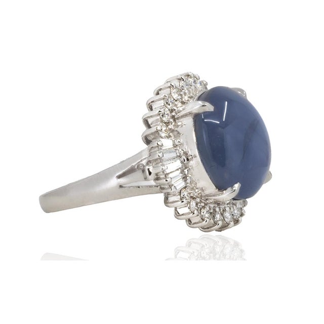 platinum ring with 12.56 carat star sapphire and 0.55 carats of round and baguette cut diamonds. 9.67 grams