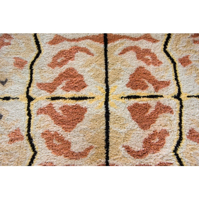 A rare mid-20th century Ecuadorian hand-knotted wool rug with a mirrored pattern of abstract reptile scale patterns, or...