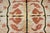A rare mid-20th century Ecuadorian hand-knotted wool rug with a mirrored pattern of abstract reptile scale patterns, or...