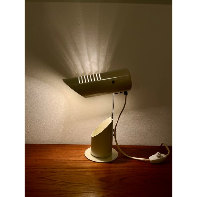 Illuminate your workspace with the exquisite Space Age Folding Table Lamp, a stunning piece from the renowned Szarvasi...