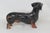 This vintage Royal Doulton Dachshund figurine is made of stunning porcelain for a timeless addition to any elegant...