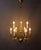 A classic brass chandelier with nine arms, made around 1950, in a high-quality cast design. The body of the chandelier...