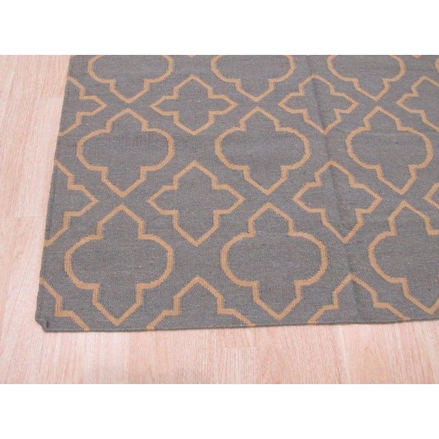 This blue wool rug features a durable flat weave construction characteristic of traditional Kilim styles. Handcrafted in...