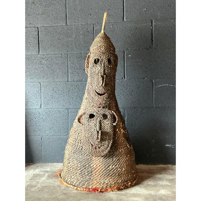 Command attention with this monumental vintage woven rattan headdress, a striking example of ethnographic-style fiber art...